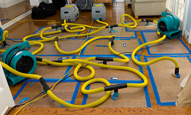 Professional Flood Damage Restoration technician working in Fayetteville, WV